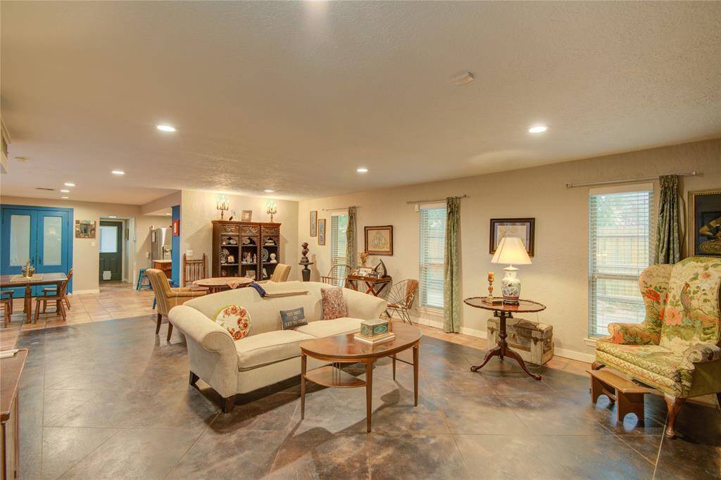 Spacious formal living area offers a seamless view into the dining room, kitchen, and breakfast nook for an open-concept feel.