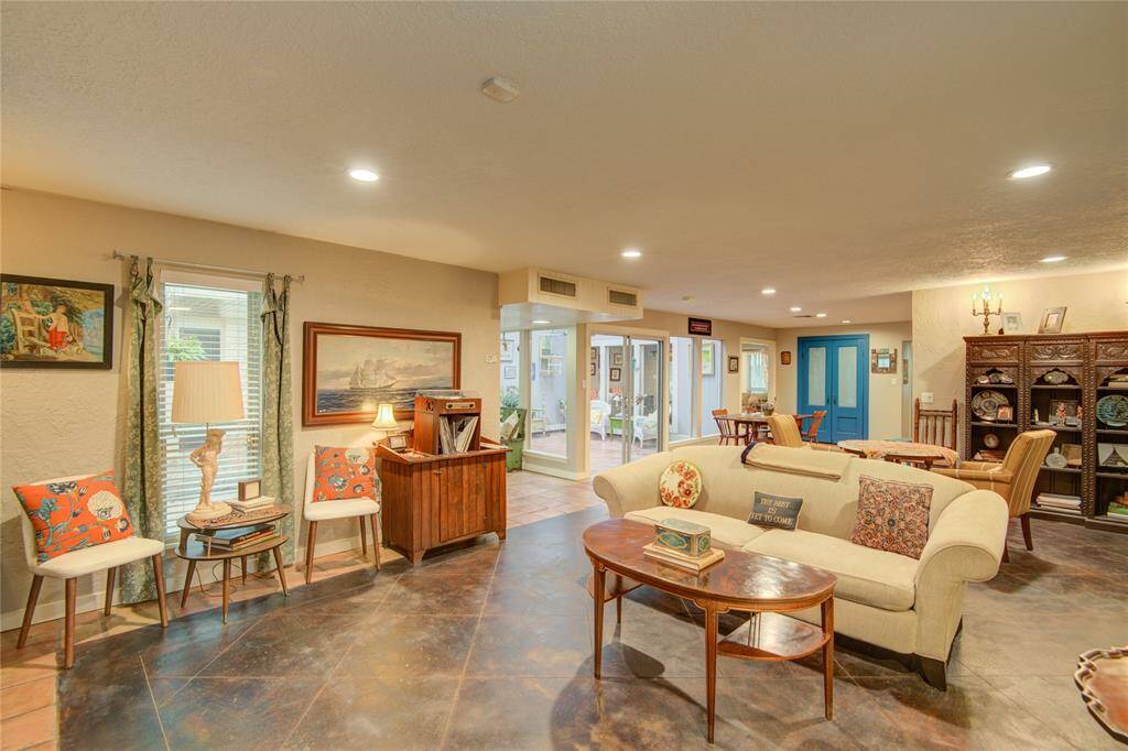 Opposite view from the living room showcases the central atrium straight ahead and the inviting breakfast area to its right.