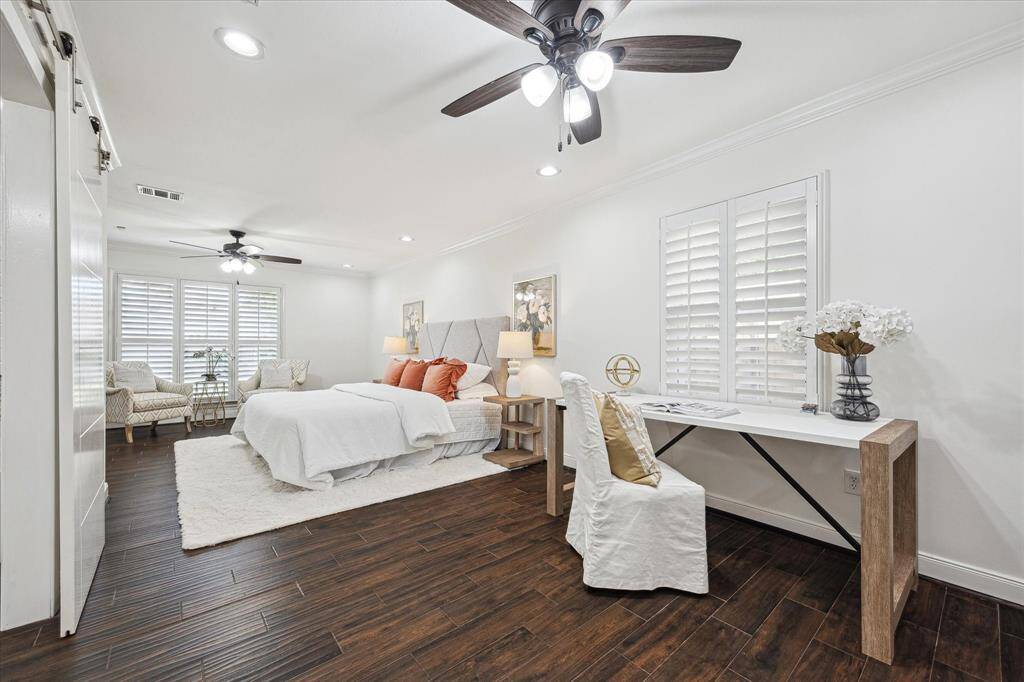The Primary bedroom is long and has plenty of room for a desk or an additional sitting area and has 4 closets - 2 on each end.
