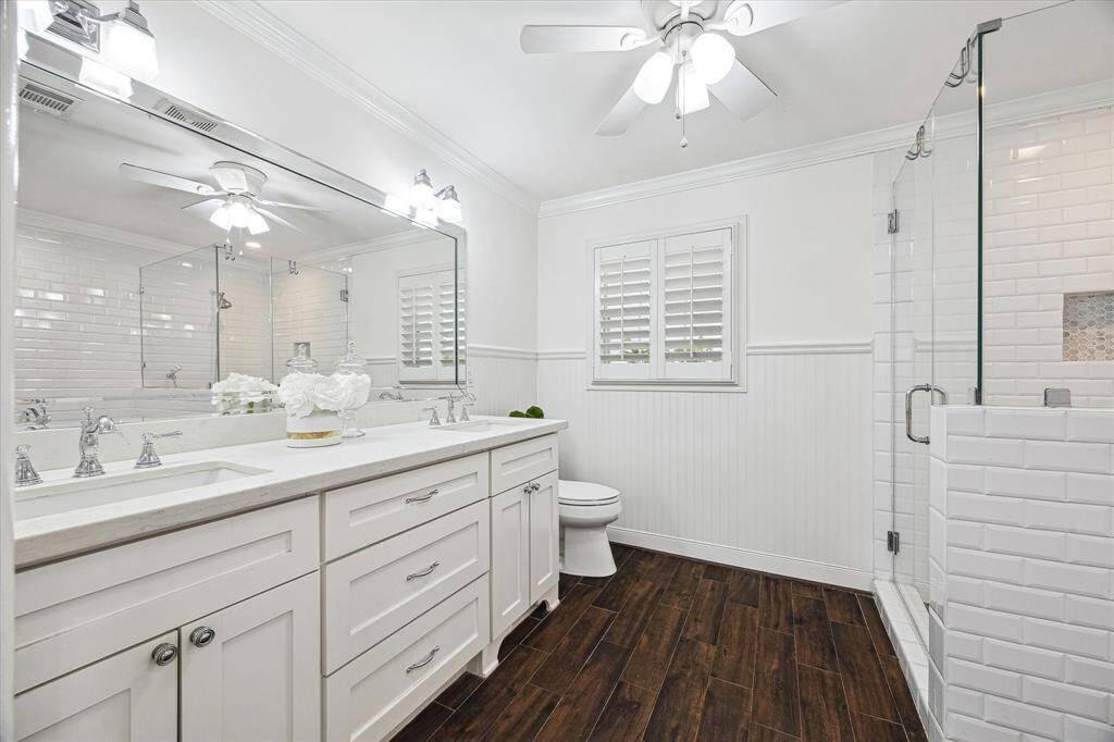 The Primary bathroom has tile flooring and a separate shower and separate tub and dual vanities.