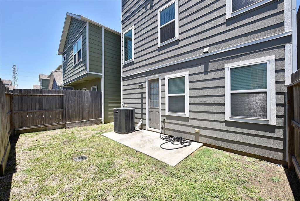 The backyard is fully fenced, offering plenty of space for pets or outdoor play!