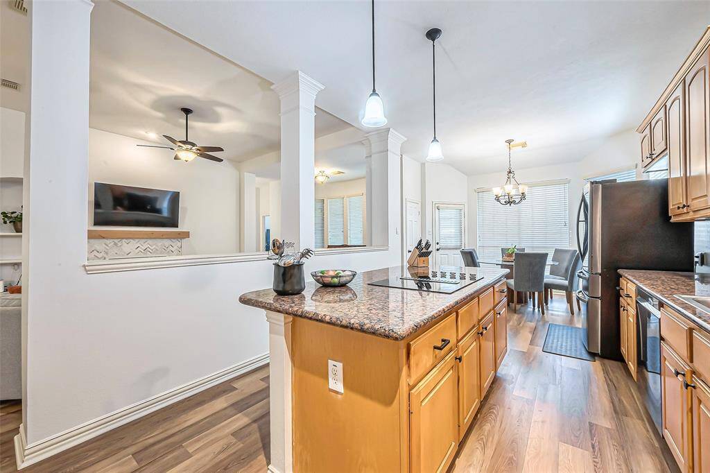 A perfect feature for any kitchen is a granite countertop island with plenty of cabinet storage