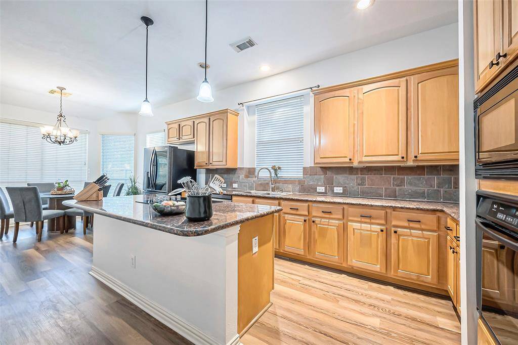 The kitchen island allows for additional seating!