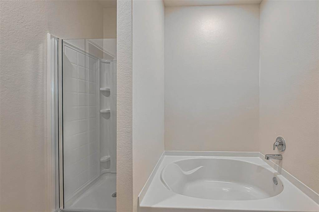 Shower and Garden tub in Primary bath.