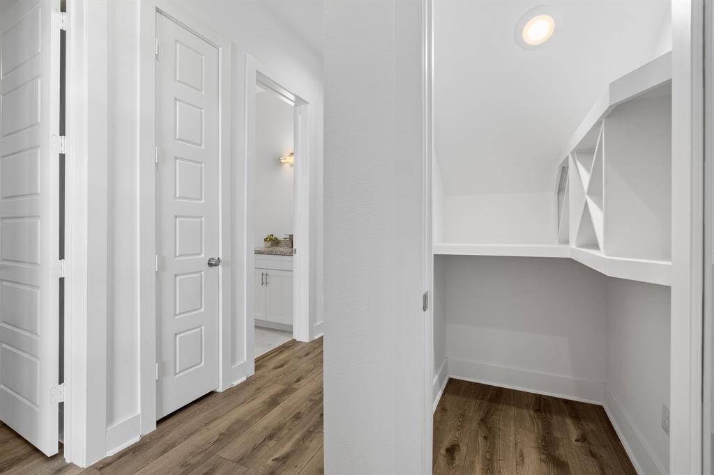 Upon entry you are greeted by wine room/storage, 1 bedroom down and full bathroom.