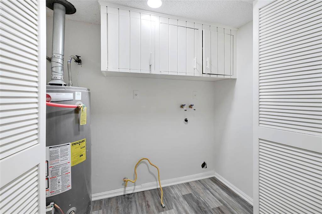Laundry room at foot of stairs.