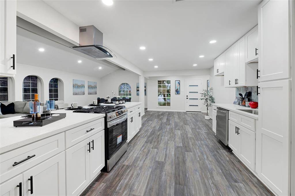 Modern updated kitchen with soft close cabinetry...bar area on the right.