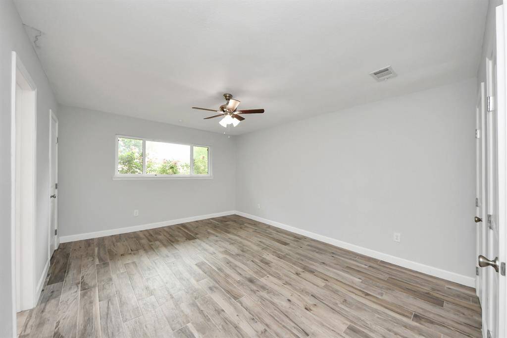 Spacious primary bedroom featuring  3 closets