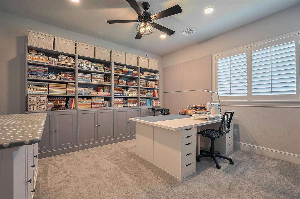 This bedroom is used as a sewing and craft room with new carpet.
