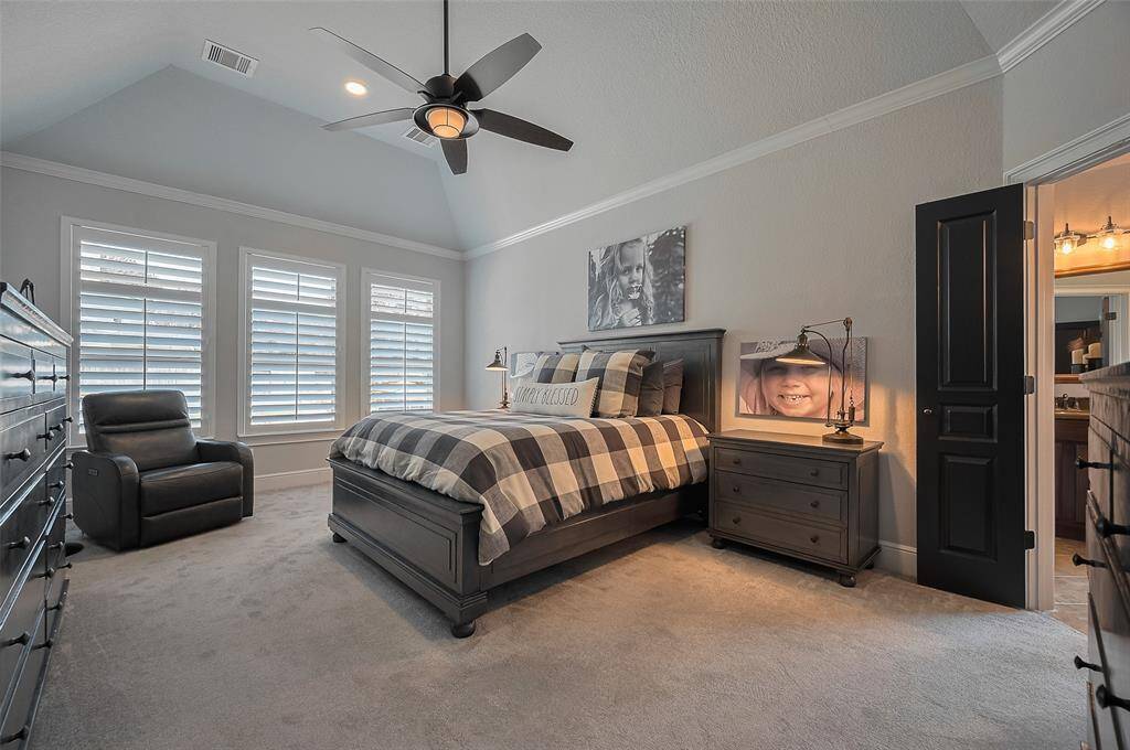 A spacious Primary Bedroom with raised ceiling and loads of space for furniture.