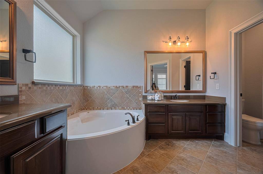 This large soaking tub is the perfect place to land after a long day for some relaxation.