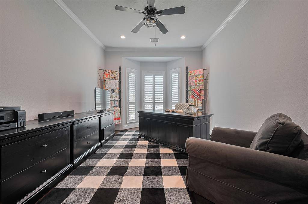 The front bedroom is used as a home office and reading room.