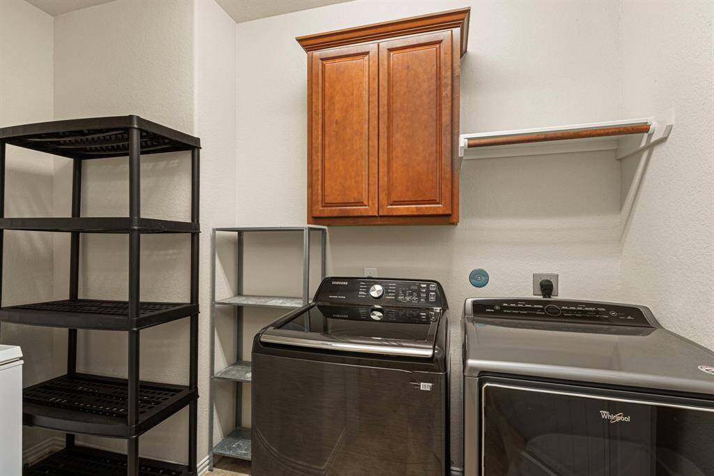 Large utility room - washer, dryer, and deep freezer included.