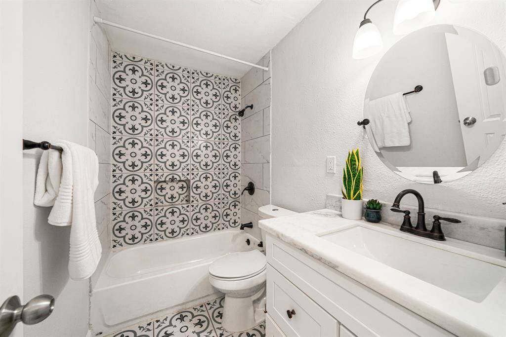Guest bath with beautiful trendy tile in the shower