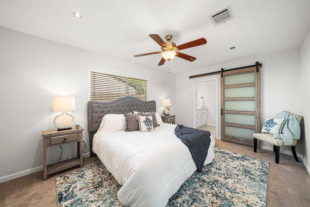 Primary bedroom that can accommodate a king size bed and plenty of room for night stands and then some!
