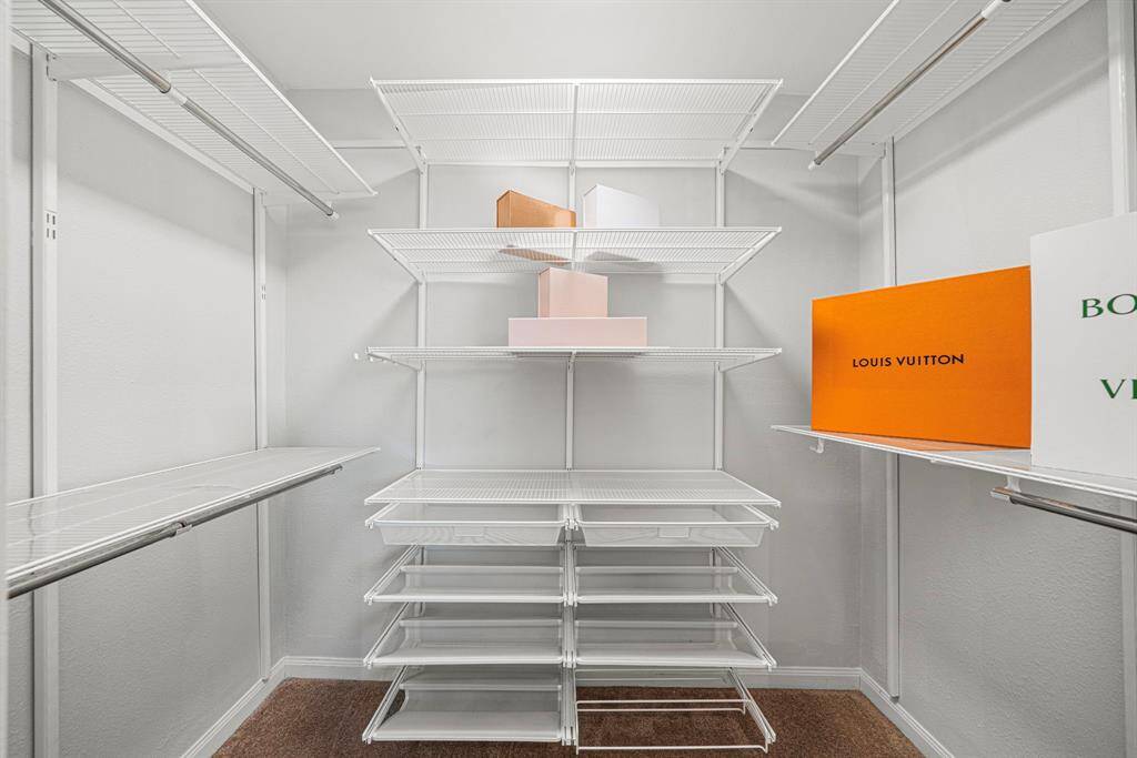 Walk in closet complete with organizers!