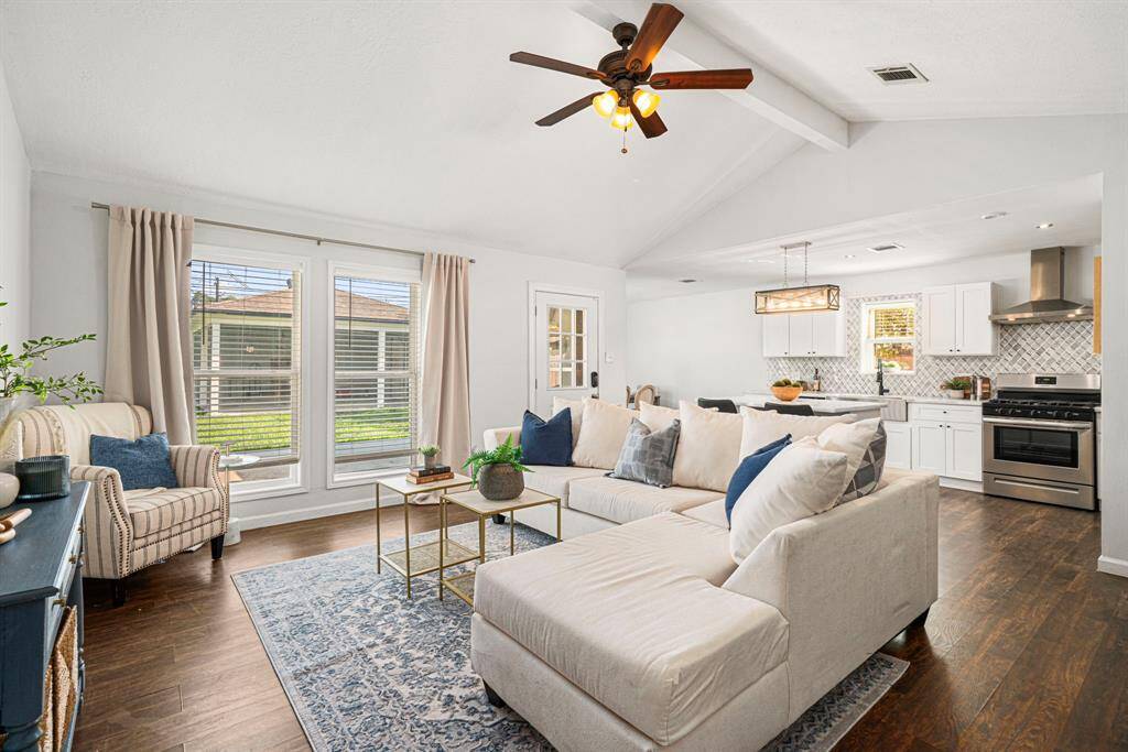 Living room with high ceilings, natural light, and open concept