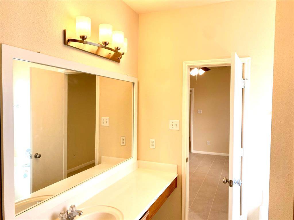 Baths updated with need light fixtures and framed mirrors