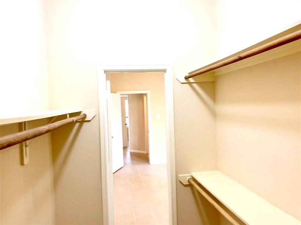 Generous space in the primary closet!