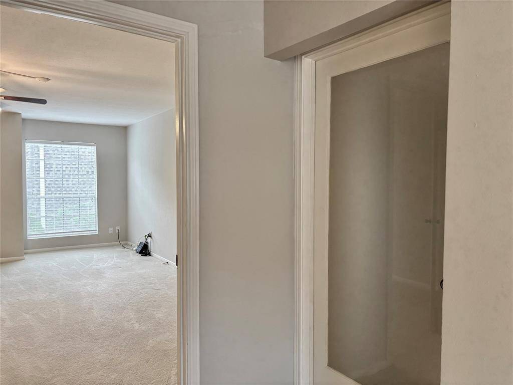 Glass Door Leads to Upstairs Primary Suite