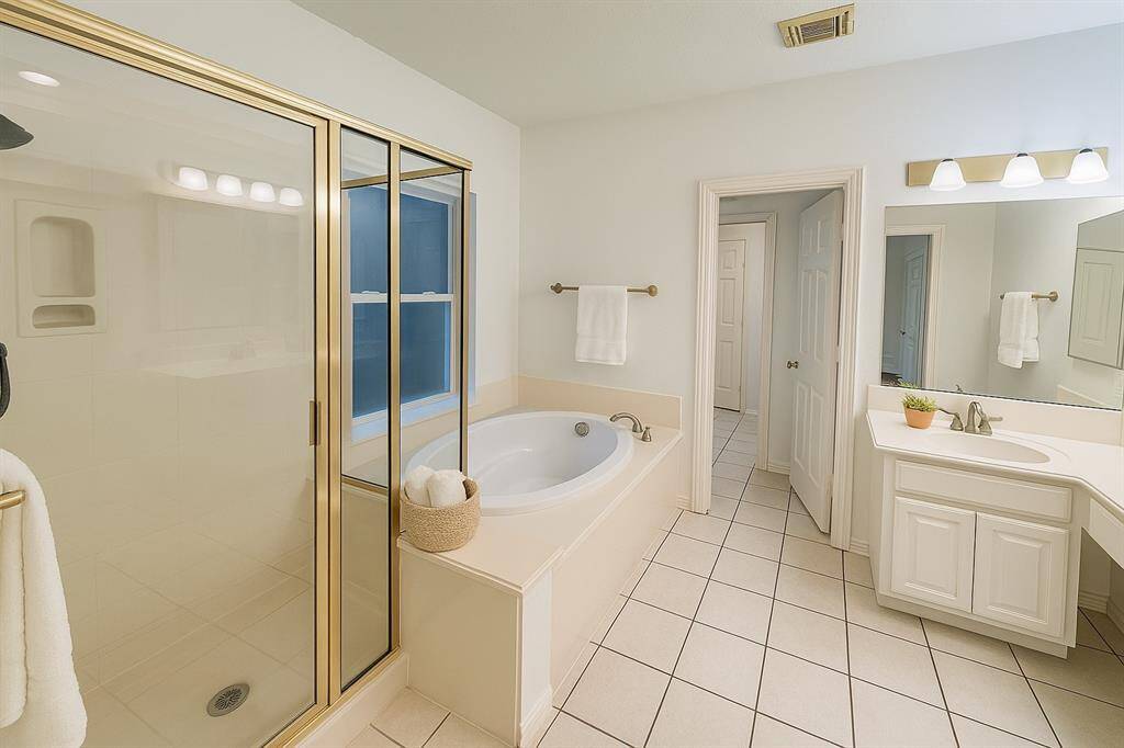 Large Primary Bath with his and her sinks and separate stand in shower