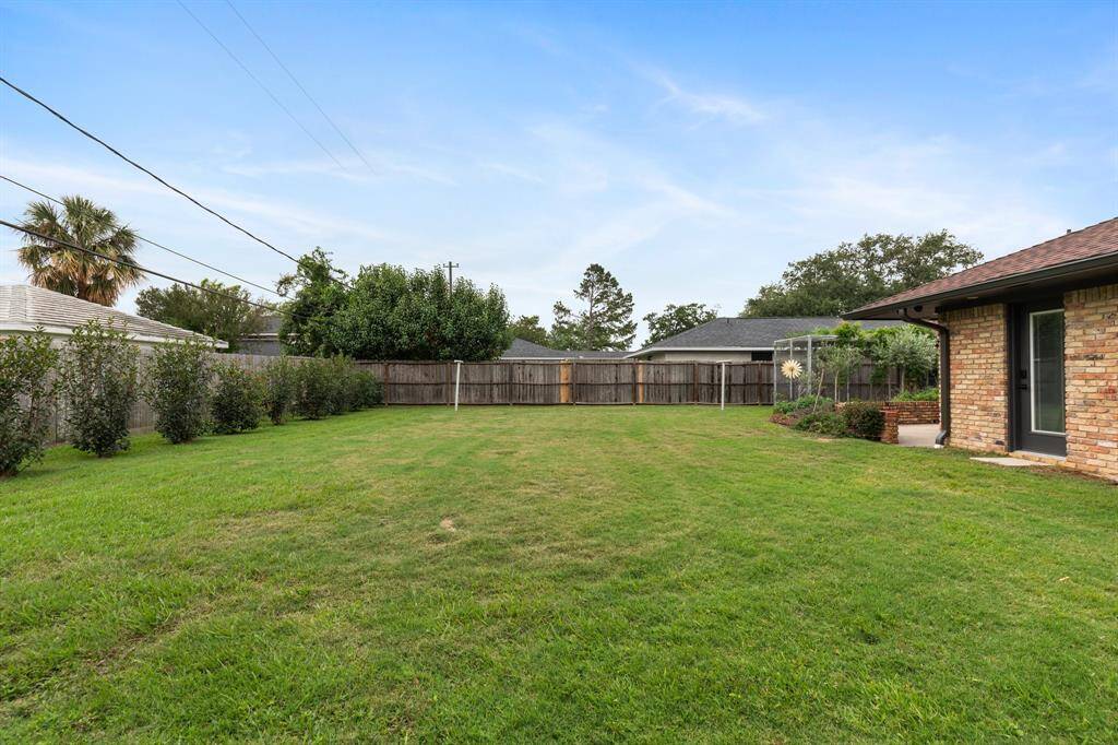 The spacious "pool-sized" back yard will be a hit with the dog.
