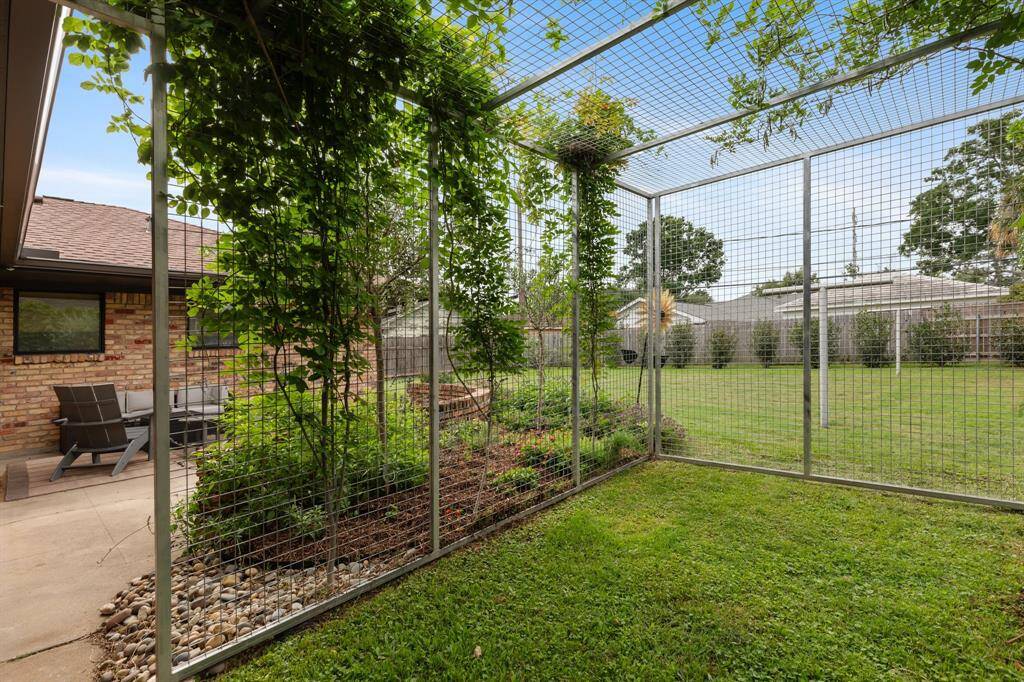 The back yard also features a custom dog run.