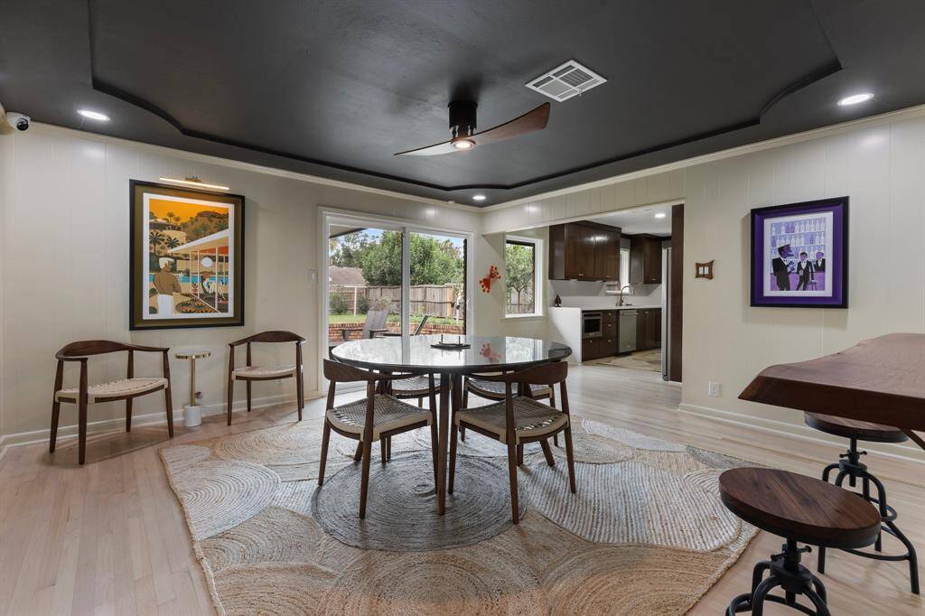 The modern dining room could easily fit a six person table and offers easy access to the patio and kitchen. This floor plan functions perfectly for everyday living or entertaining.