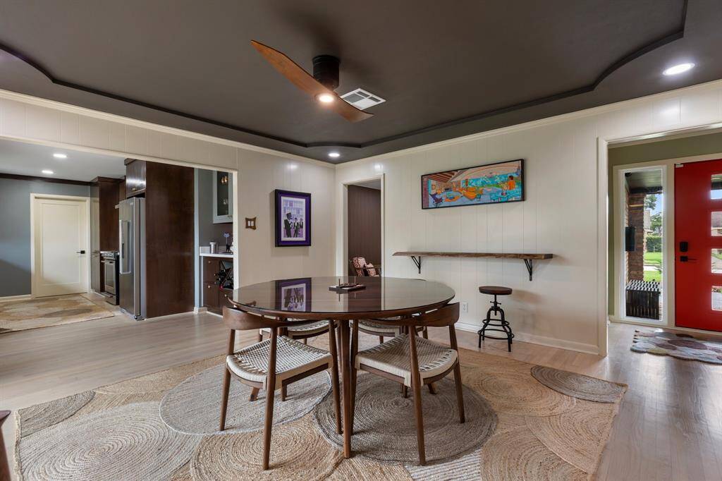 Another view of the dining room that shows the flow to the kitchen.  Interior laundry room is thru the kitchen space.
