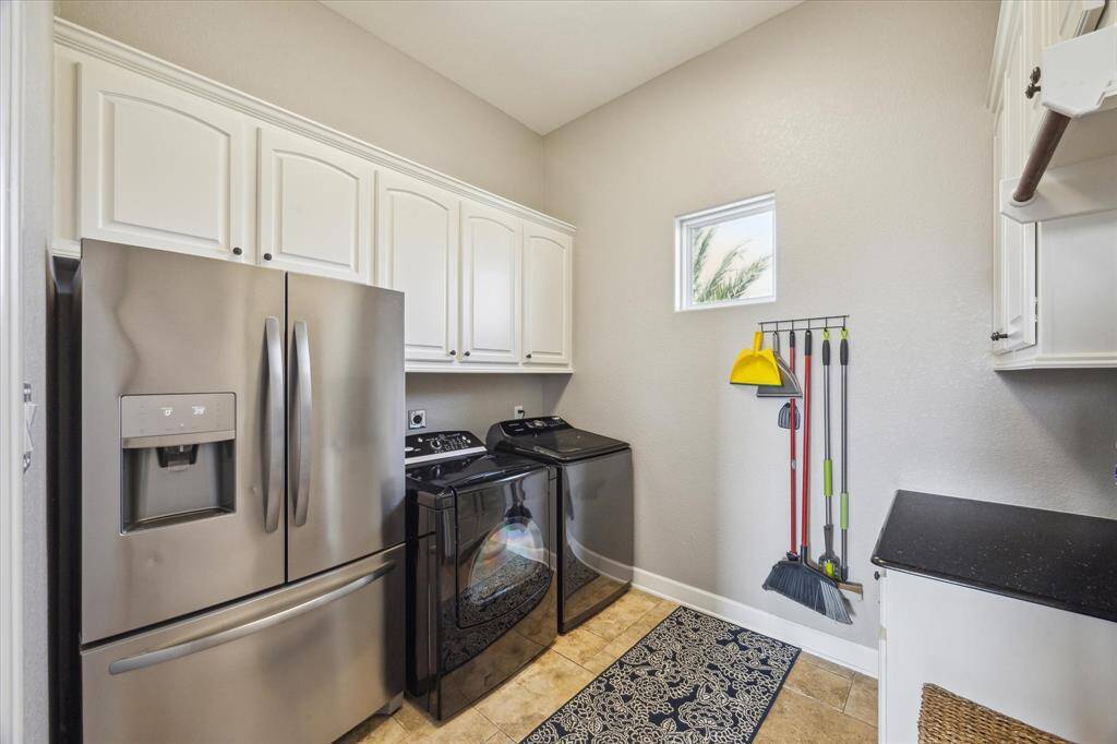 Oversized laundryroom offers plenty of storage.