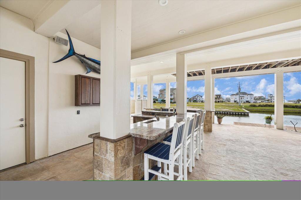 Guests can flow seamlessly outdoors to a covered lounge area, for sunset cocktails or weekend barbecues.