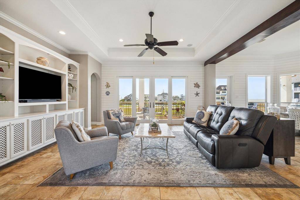 Nestled right on the water's edge, the home offers panoramic views from nearly every room, blending indoor elegance with outdoor tranquility.