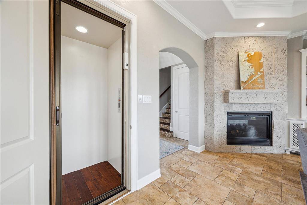 Located just off the main living area, the elevator offers convenient access between floors.