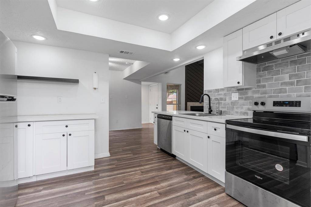 The kitchen connects seamlessly to the living and dining areas, perfect for entertaining and modern daily living.Enjoy the smooth top electric range for easy cleaning.