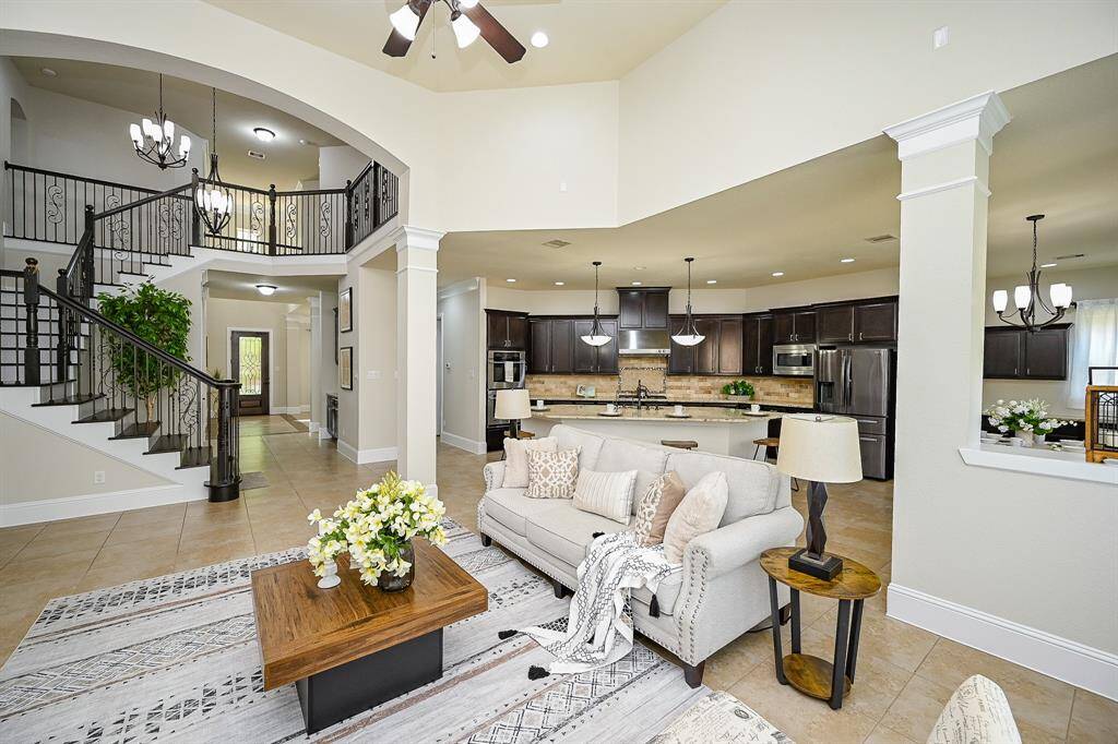 The neutral tones and abundant natural light create a warm, inviting atmosphere, perfect for family gatherings.