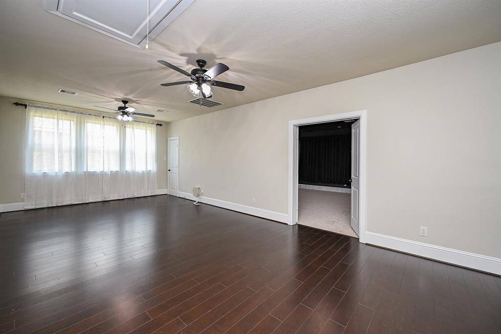 Spacious game room features double doors leading to the media or entertainment room.