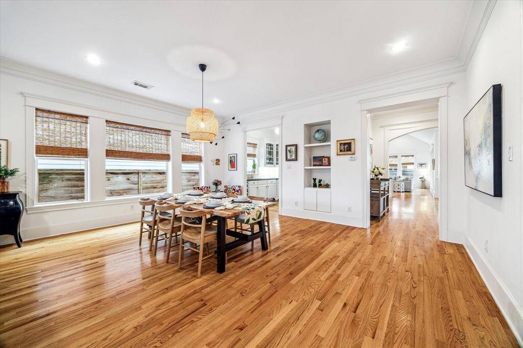 Plan your next dinner party in the large dining area topped by a lovely chandelier and bordered by built-ins and a convenient butler’s pantry.