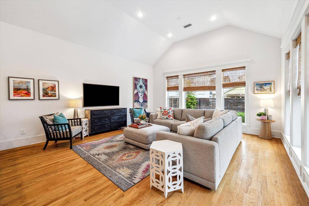 This vaulted family room is sure to become a favorite gathering place with its easy access to the kitchen and backyard.