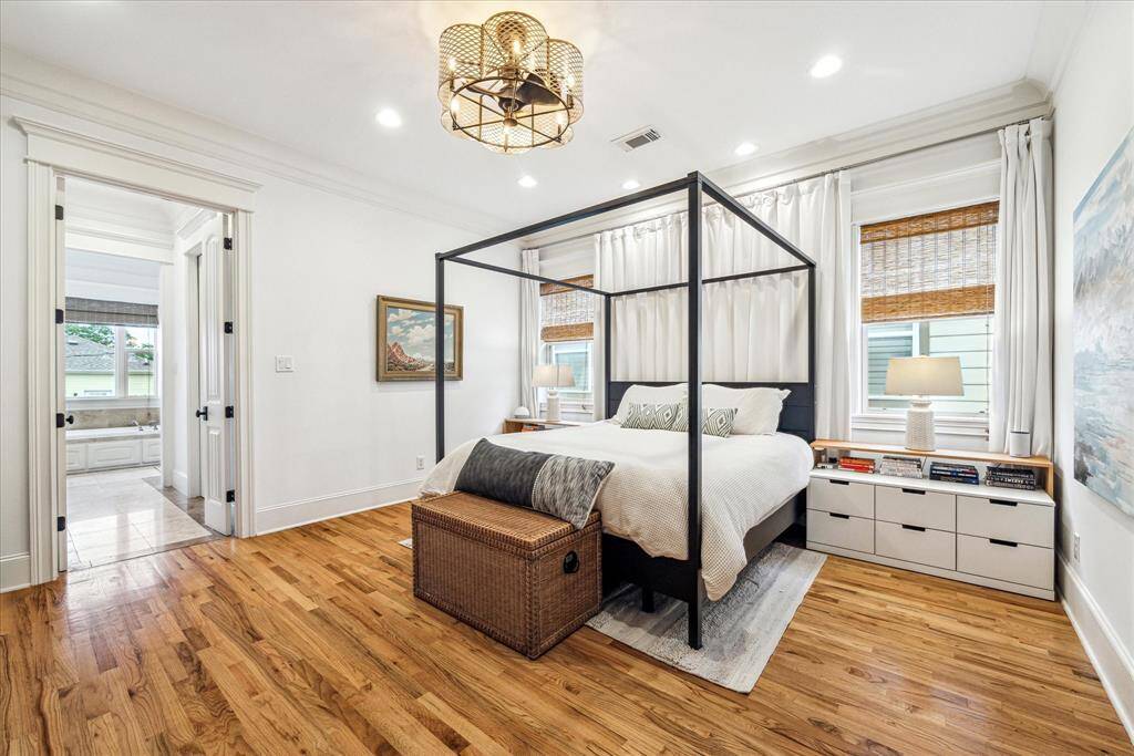 Morning routines are effortless in the stunning primary bathroom, where two separate vanities offer plenty of storage and counter space.