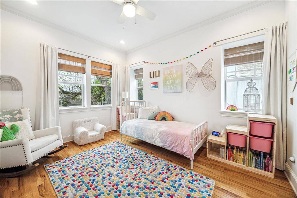 This secondary suite offers a walk-in closet, a new ceiling fan, double exposures and a private bathroom.