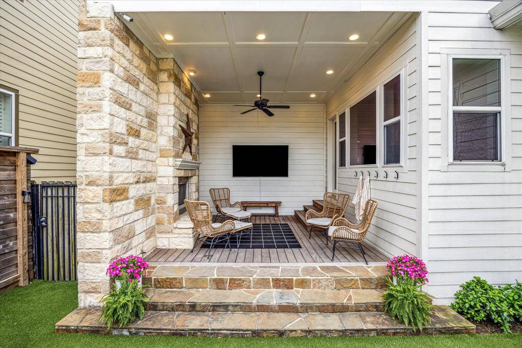 Green lawns and handsome hedges add greenery to this fully fenced outdoor oasis.