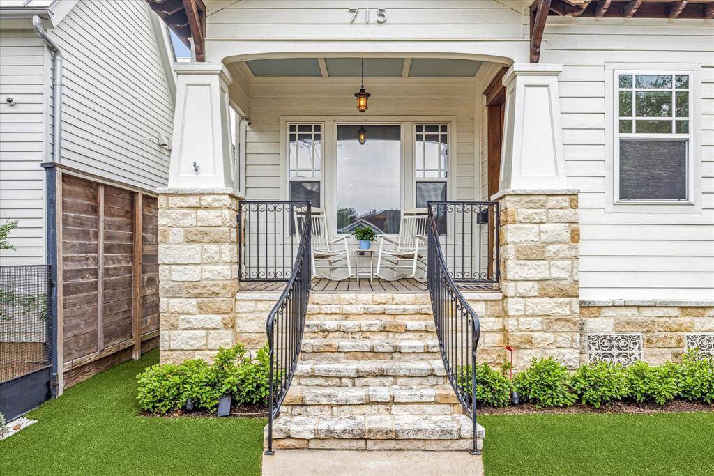 A covered porch and gorgeous foyer with herringbone floors make a warm welcome in this 3,767-square-foot home.