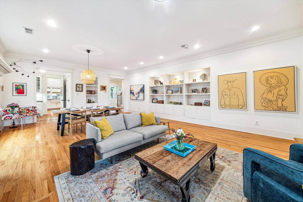 Relax in front of a granite-faced fireplace flanked by built-in shelving.