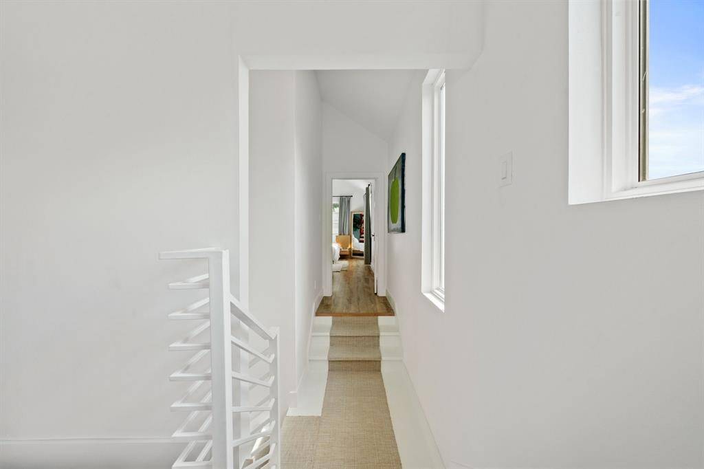 This hallway connects the office and primary bedroom