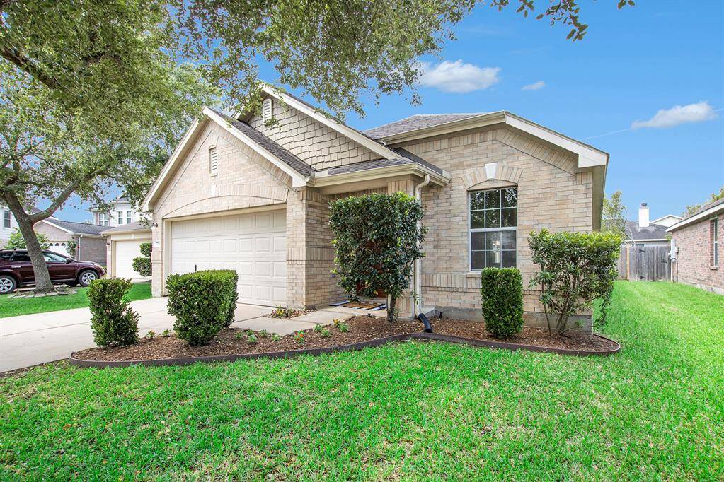 Home Sweet Home! This lovely one-story brick home has a clean, classic look and sits on a quiet, tree-lined street. The front yard is neat and green with well-kept bushes and shady trees that make it feel extra inviting. A cozy covered entry and two-car garage add both charm and convenience. It’s the kind of home that feels warm and welcoming the moment you pull into the driveway.