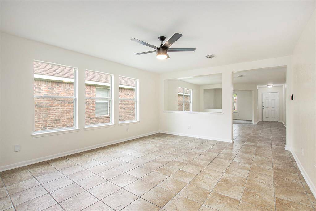 As we move into the heart of the home, we enter the second versatile space, perfectly suited to be a second living area, dining room, or anything else you envision, offering endless possibilities to customize the layout to your needs.