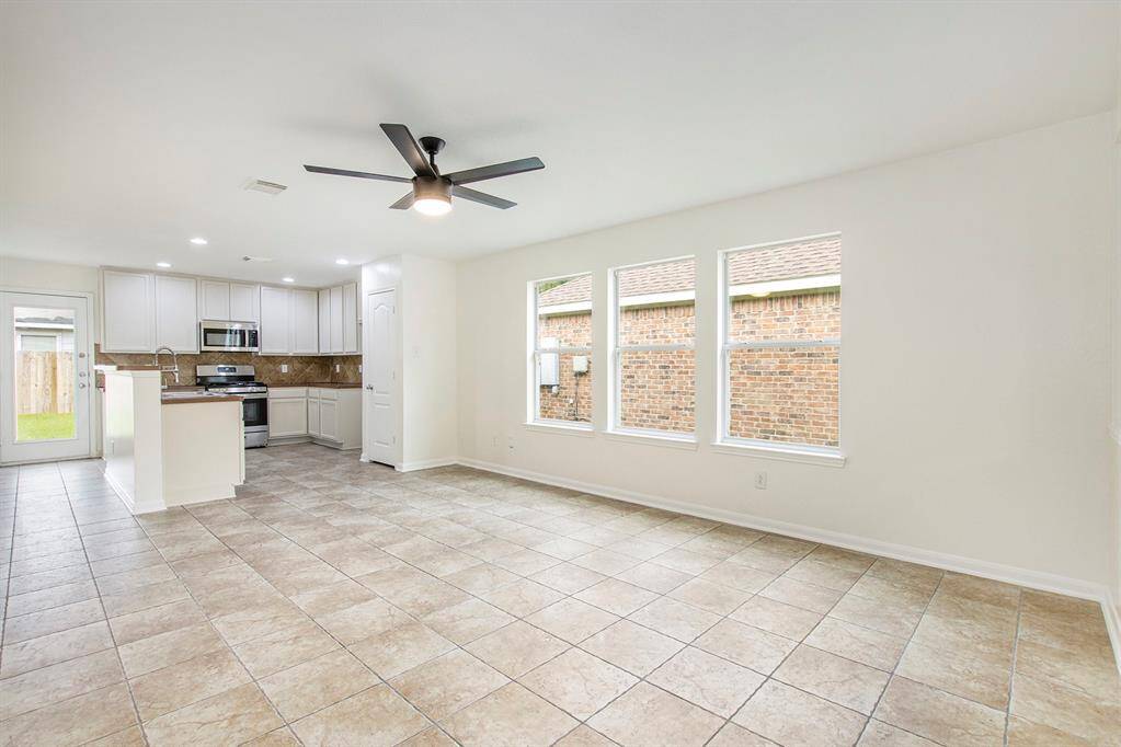 Standing in the center of the home, this view showcases the open-concept kitchen, highlighting the spacious island and modern kitchen area—perfect for both everyday living and entertaining.