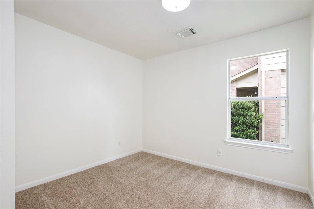 The two bedrooms are equally spacious, featuring ample closet space and brand-new carpet, offering comfort and a fresh, modern feel.