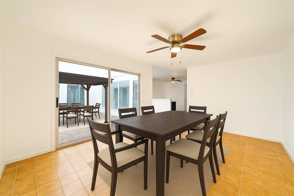 Rendering with a vision for the dining room and Patio (virtually Staged)