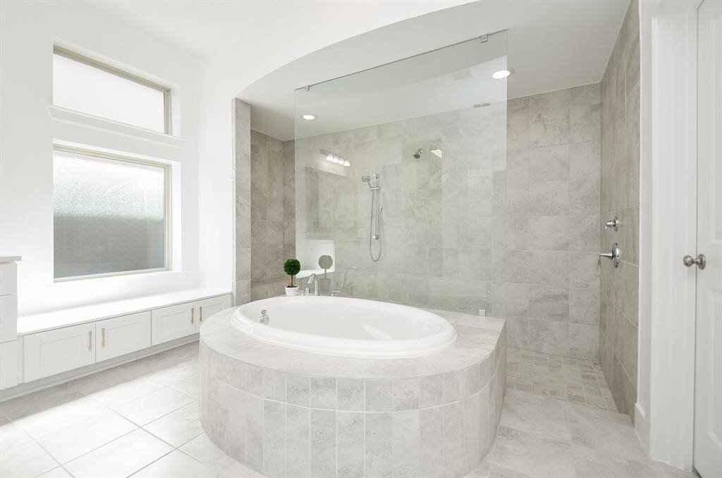 GORGEOUS Primary Bath with Walk Through Dual Head Shower and Soaking Tub
